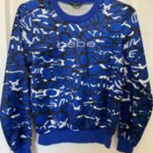 Bebe blue satin pull over shirt in XXS